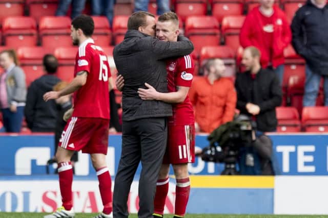 Celtic manager Brendan Rodgers embraces Aberdeen winger Jonny Hayes at full-time after their clubs met earlier in the season. Picture: SNS