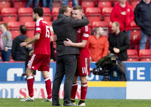 Celtic manager Brendan Rodgers embraces Aberdeen winger Jonny Hayes at full-time after their clubs met earlier in the season. Picture: SNS