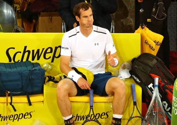 Andy Murray of Great Britain gives a less-than-enthusiastic thumbs up to his coaching staff. Picture: Clive Rose/Getty Images