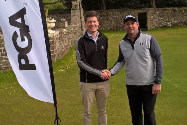 Rowallan Castle director of golf David Addison, left, congratulates Scott Henderson after his victory in Ayrshire