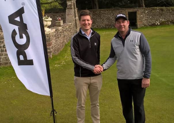 Rowallan Castle director of golf David Addison, left, congratulates Scott Henderson after his victory in Ayrshire