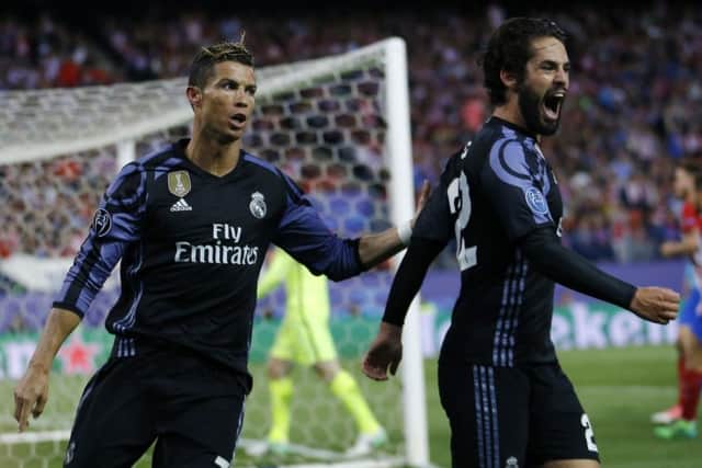 Isco, right, celebrates with Cristiano Ronaldo after scoring for Real Madrid. Picture: AP.