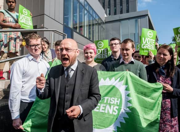 Patrick Harvie addresses Green members outside Glasgow University library. The party is standing in just three seats in Scotland. Picture: John Devlin/TSPL
