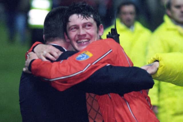 Dundee United winger Andy McLaren hugs manager Billy Kirkwood after the 1996 play-off  Picture: SNS.
