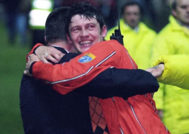 Dundee United winger Andy McLaren hugs manager Billy Kirkwood after the 1996 play-off Picture: SNS.