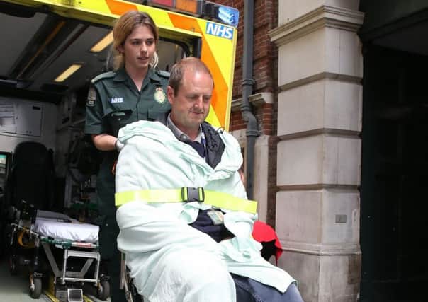 BBC Cameraman Giles Wooltorton is helped by ambulance staff after reportedly being hit by Jeremy Corbyn's vehicle. Picture: Neil P Mockford/Getty Images