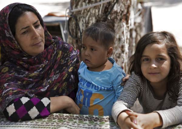 Women like Nejebar, from Afghanistan, with children  Sudai, 5, and Shikufa, 8, are stuck in limbo in Greece after fleeing from Taliban death threats, and do not know what their future holds