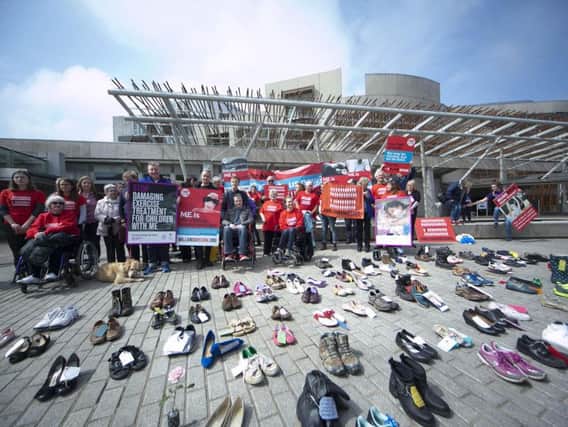 ME sufferers leave their shoes outside the Scottish Parliament.