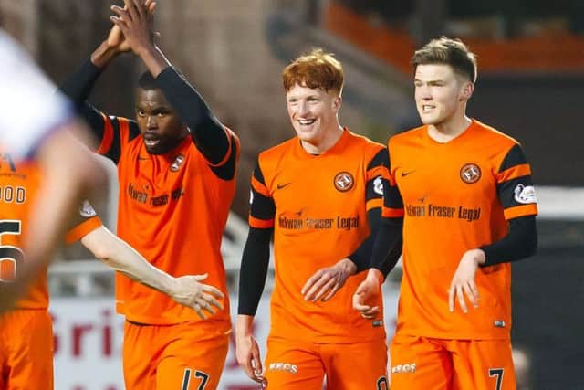 Wato Kuate, left, celebrates his goal with fellow scorers Simon Murray, centre, and Blair Spittal. Picture: SNS