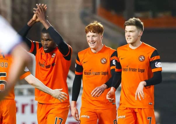 Wato Kuate, left, celebrates his goal with fellow scorers Simon Murray, centre, and Blair Spittal. Picture: SNS