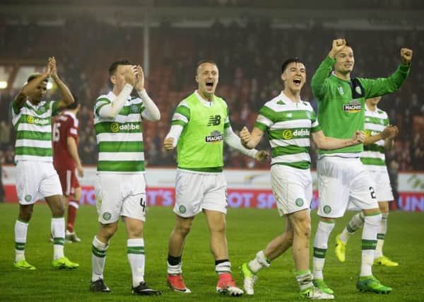 Celtic's Kieran Tierney and Leigh Griffiths lead the celebrations at the final whistle in Aberdeen. Picture: Jeff Holmes/PA Wire.