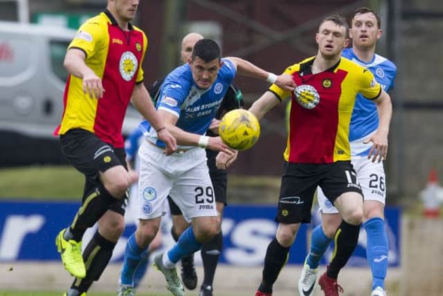 St Johnstone's Grham Cummins in action against Liam Lindsay. Pic: SNS/Kenny Smith