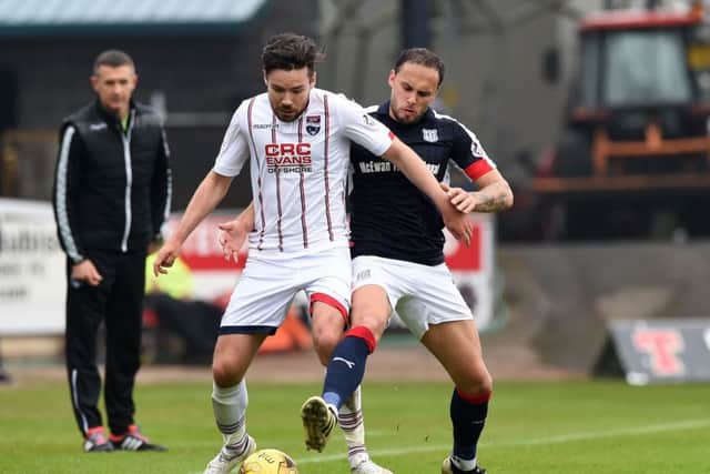 Ross County's Ryan Dow battles with Dundee's Tom Hateley. Pic: SNS/Paul Devlin