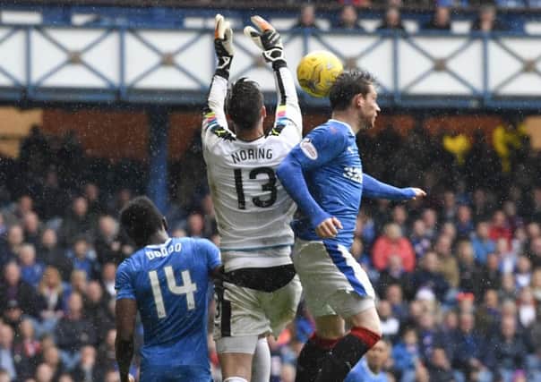 Viktor Noring fails to hold onto the ball inside his penalty box prior to Rangers' second goal. Pic: SNS/Rob Casey