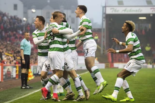 Celtic celebrate on their way to defeating Aberdeen 3-1 at Pittodrie to reach 100 points. Pic: SNS/Alan Harvey