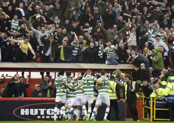 Celtic celebrate Stuart Armstrong's goal with the fans. Pic: SNS/Craig Williamson