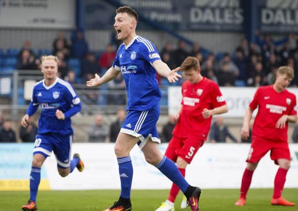 Peterhead's Rory McAllister celebrates after he scores a penalty for his side. Picture: Graham Stuart/SNS
