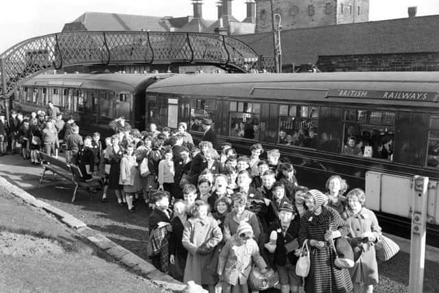 Murrayburn School pupils board a British Rail TV train bound for St Andrews at Gorgie East station in Edinburgh in 1962. The train, equipped with closed-circuit television, allowed the children to be taught as they travelled along. Gorgie East closed to passenger services in the same year. Picture: TSPL