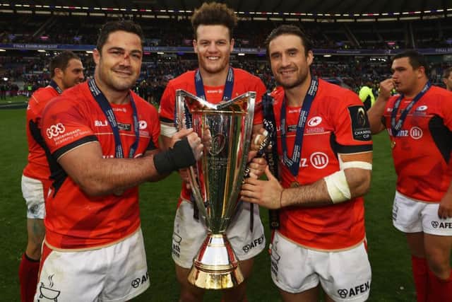 Scotland centre Duncan Taylor, centre, celebrates with Brad Barritt, left, and Marcelo Bosch. Photograph: David Rogers/Getty
