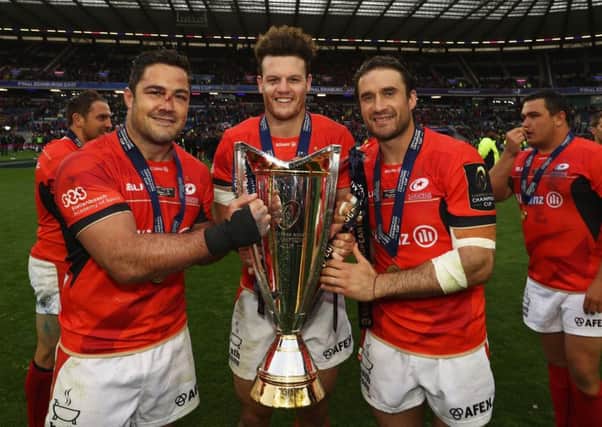 Scotland centre Duncan Taylor, centre, celebrates with Brad Barritt, left, and Marcelo Bosch. Photograph: David Rogers/Getty