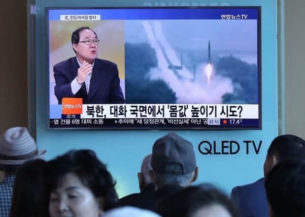 A elevision news programme, showing file footage of a North Korean missile launch, at a railway station in Seoul on May 14, Picture; Getty