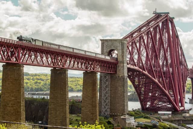 The Flying Scotsman heads into Fife on the first of two trips over the Forth Bridge today. Picture: SWNS