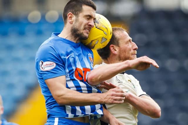 Kilmarnocks Gary Dicker (left) battles for the ball with Gary Warren. Picture: SNS.