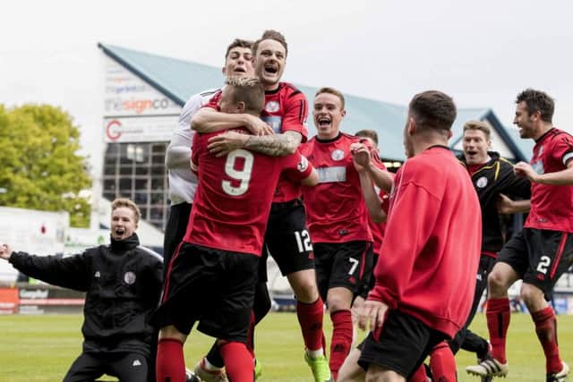 Brechin City players dance with joy following their shoot-out victory over Raith Rovers. Picture: SNS.