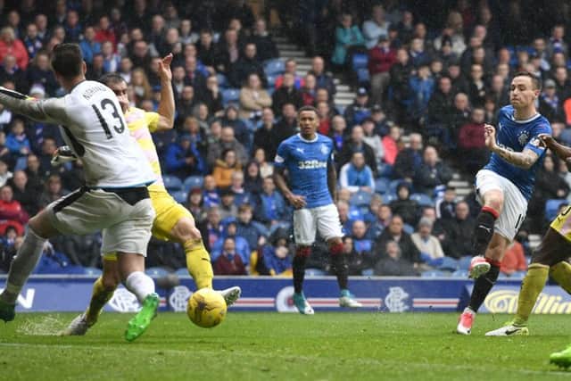 Barrie McKay drills the ball into the net to give Rangers a 2-1 win. Picture: SNS.