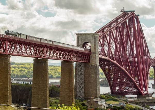 The Flying Scotsman made its second crossing over the Forth Bridge earlier today since its 2016 restoration. Picture: SWNS