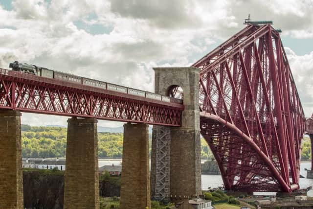 The Flying Scotsman made its second crossing over the Forth Bridge earlier today since its 2016 restoration. Picture: SWNS