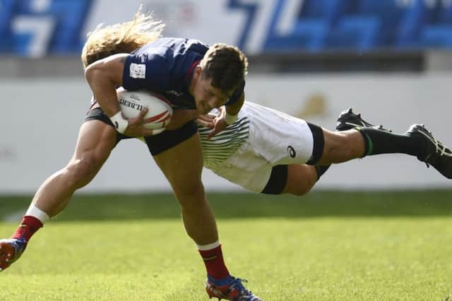 Scotland try-scorer Scott Wight is tackled by South Africa's Glenn Bryce. Picture: AFP/Getty