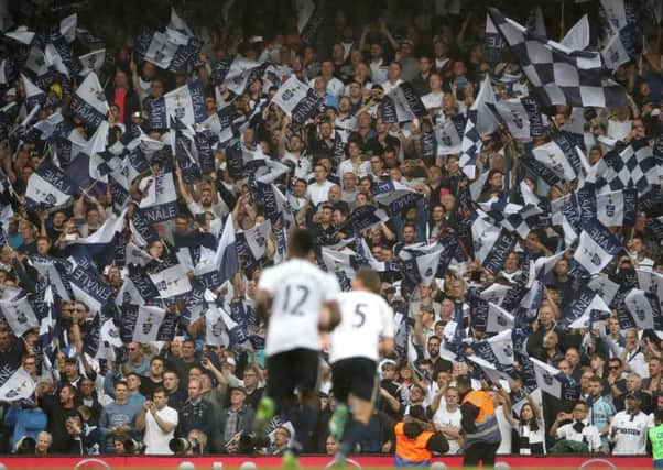 Players and fans celebrate the win, second place in the table and wave goodbye toWhite Hart Lane. Picture: PA.