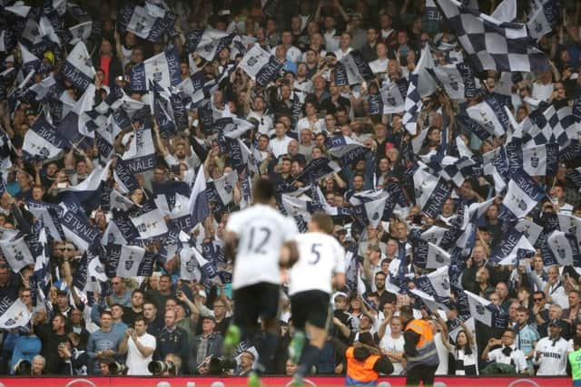 Players and fans celebrate the win, second place in the table and wave goodbye toWhite Hart Lane. Picture: PA.