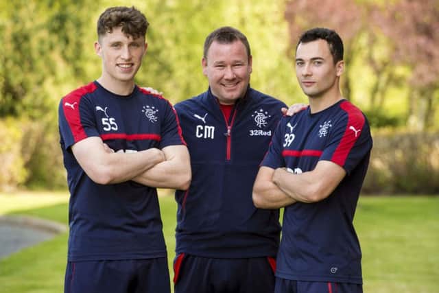 Rangers' Head of Academy Craig Mulholland (centre) with youth players Jamie Barjonas (left) and Ross Lyon. Pic: SNS/Alan Harvey