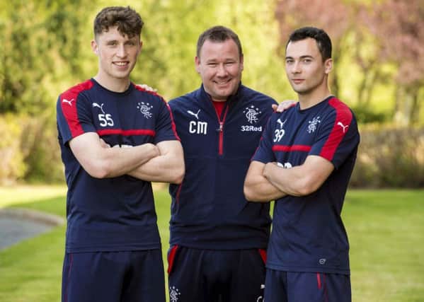 Rangers' Head of Academy Craig Mulholland (centre) with youth players  Jamie Barjonas (left) and Ross Lyon. Pic: SNS/Alan Harvey