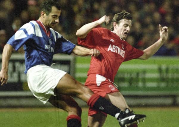 Paul Mason and Dale Gordon battle it out at Ibrox in 1993. Picture: SNS.
