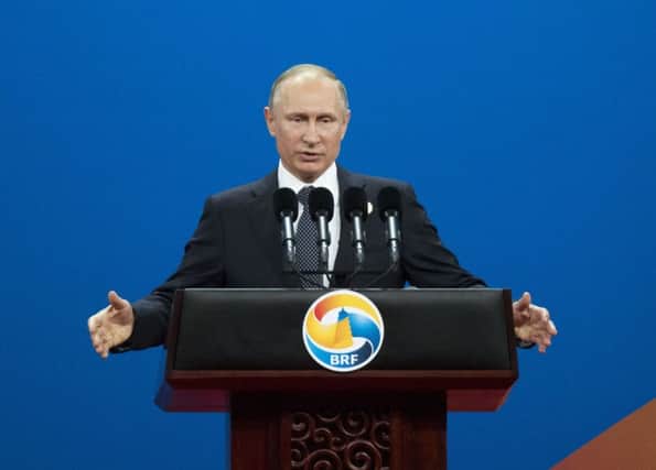 Russian president Vladimir Putin's government has links to several state news agencies. Picture: AP Photo/Alexander Zemlianichenko