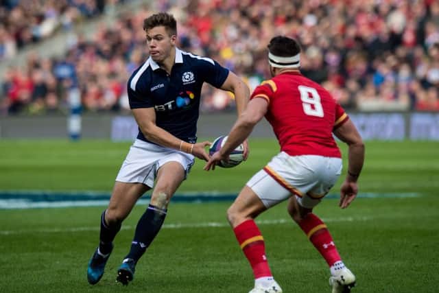 Scotland's Huw Jones in action against Wales' Rhys Webb. Pic: SNS/Ross Parker