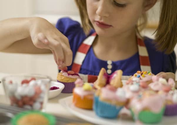 Far from being seen as an occasional treat, sugary, unhealthy snacks are all too often seen as a regular feature of childrens diets. Picture: Getty Images