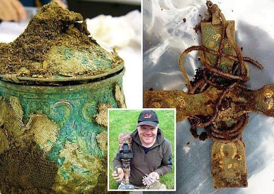 Derek McLennan (centre) with some of the Galloway hoard which includes a pot (left) that contained several small items and a silver embellished cross thought to date from the 9th or 10th Century.
