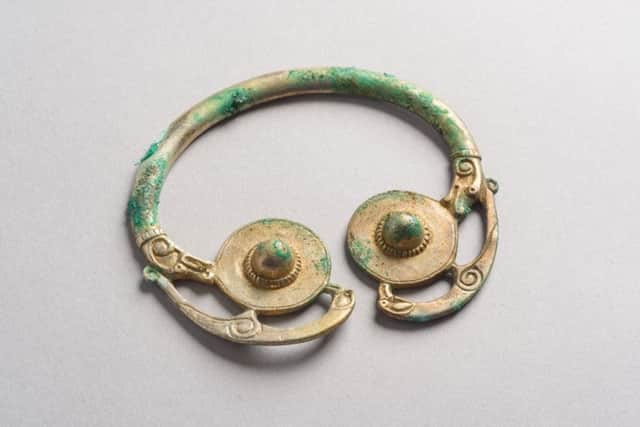 A silver Irish pennanular brooch that was in the Carolingian  pot found by Mr McLennan. The pieces have been painstakingly restored by Historic Environment Scotland. PIC: HES.