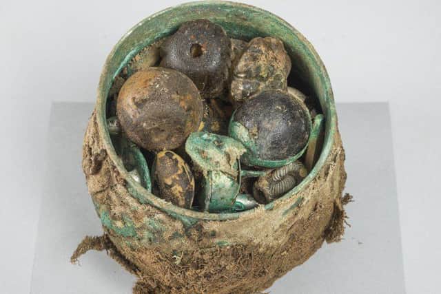 The pot stuffed with artefacts thought to be up to 1,000 years old. PIC: HES.