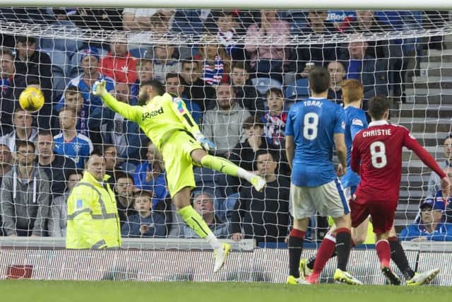 Aberdeen's Ryan Christie scores his side's second goal of the game against Rangers at Ibrox. Picture: Jeff Holmes/PA Wire