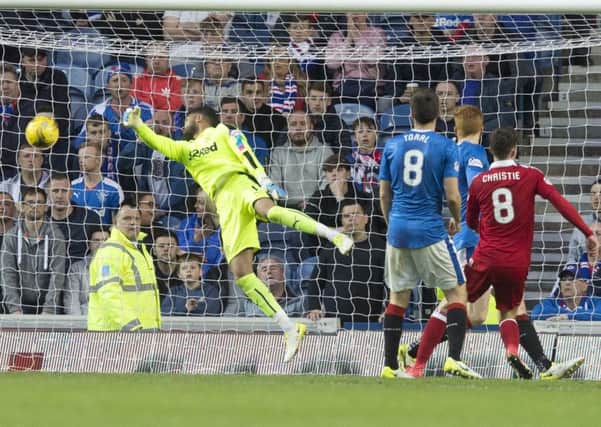 Aberdeen's Ryan Christie scores his side's second goal of the game against Rangers at Ibrox. Picture: Jeff Holmes/PA Wire