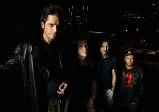 Chris Cornell, left, with Tim Commerford, Brad Wilk and Tom Morello. Picture: AP Photo/Manuel Balce Ceneta