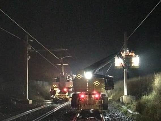 A faulty component as part of the overhead power lines is likely to have to be replaced. Picture: Network Rail