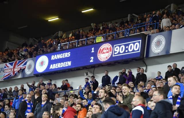 Aberdeen won against Rangers at Ibrox for the first time since 1991. One Rangers fan took excepetion and stole the match ball. Pic: SNS/Rob Casey