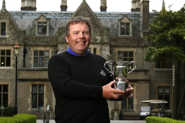 Carnoustie professional Fraser Mann with the PGA Senior Championship trophy.