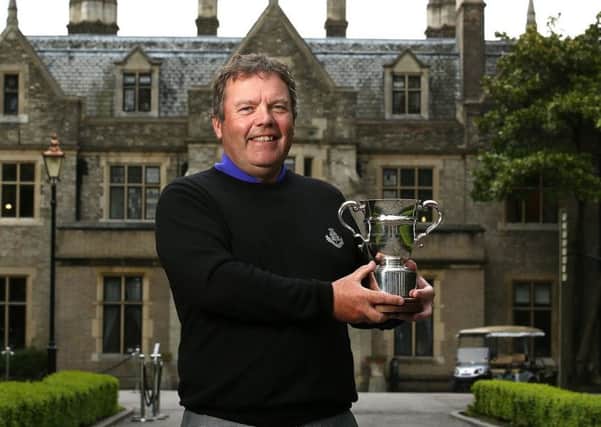 Carnoustie professional Fraser Mann with the PGA Senior Championship trophy.